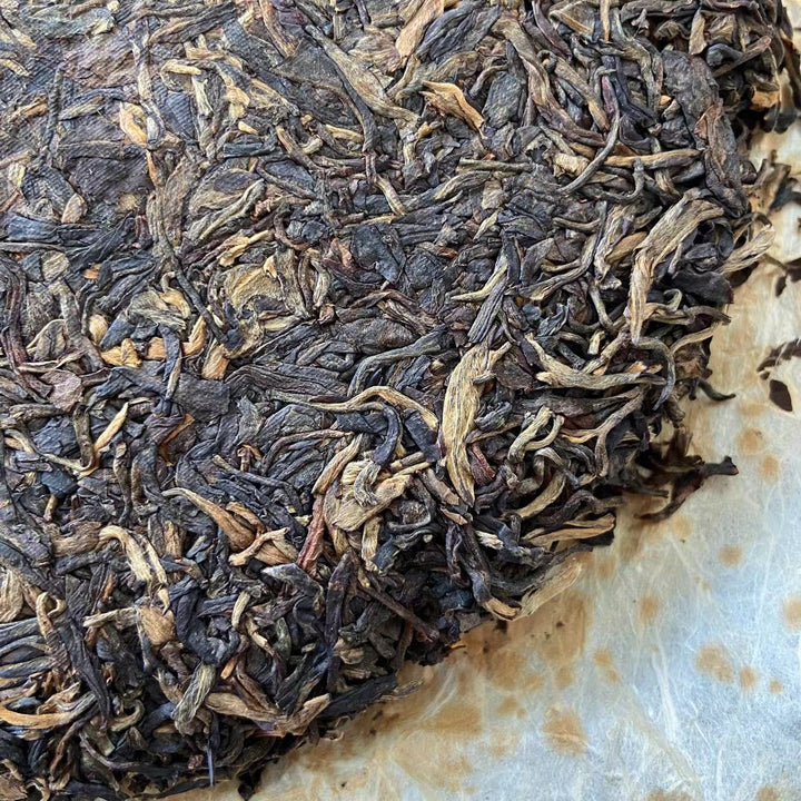 2007 LiMing "Bu Lang Shan - Qiao Mu Gu Shu - Nv Er Gong Bing" (Bulang Mountain - Ancient Arbor Tree) Cake 357g Puerh Raw Tea Sheng Cha