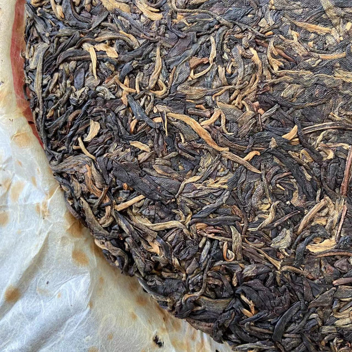 2007 LiMing "Bu Lang Shan - Qiao Mu Gu Shu - Nv Er Gong Bing" (Bulang Mountain - Ancient Arbor Tree) Cake 357g Puerh Raw Tea Sheng Cha