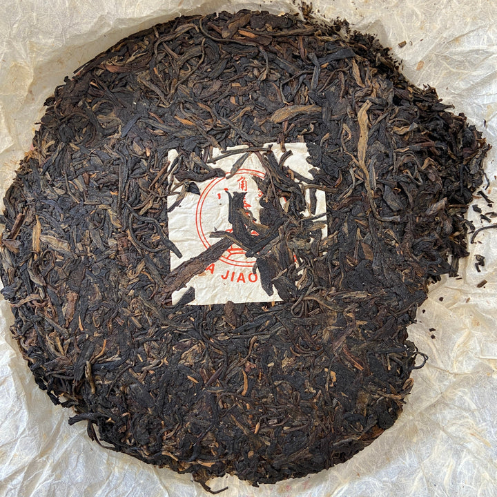 2004 LiMing "Cha Wang - Qiao Mu Ye Sheng - Ban Zhang & Bu Lang & Nan Nuo" (King Tea - Arbor Wild - Banzhang & Bulang & Nannuo) Cake 400g Puerh Sheng Cha Raw Tea