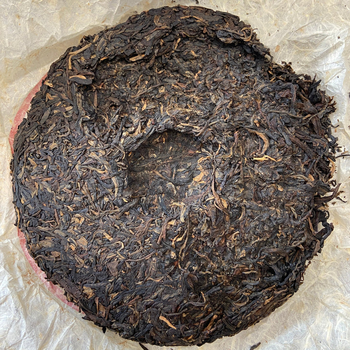 2004 LiMing "Cha Wang - Qiao Mu Ye Sheng - Ban Zhang & Bu Lang & Nan Nuo" (King Tea - Arbor Wild - Banzhang & Bulang & Nannuo) Cake 400g Puerh Sheng Cha Raw Tea