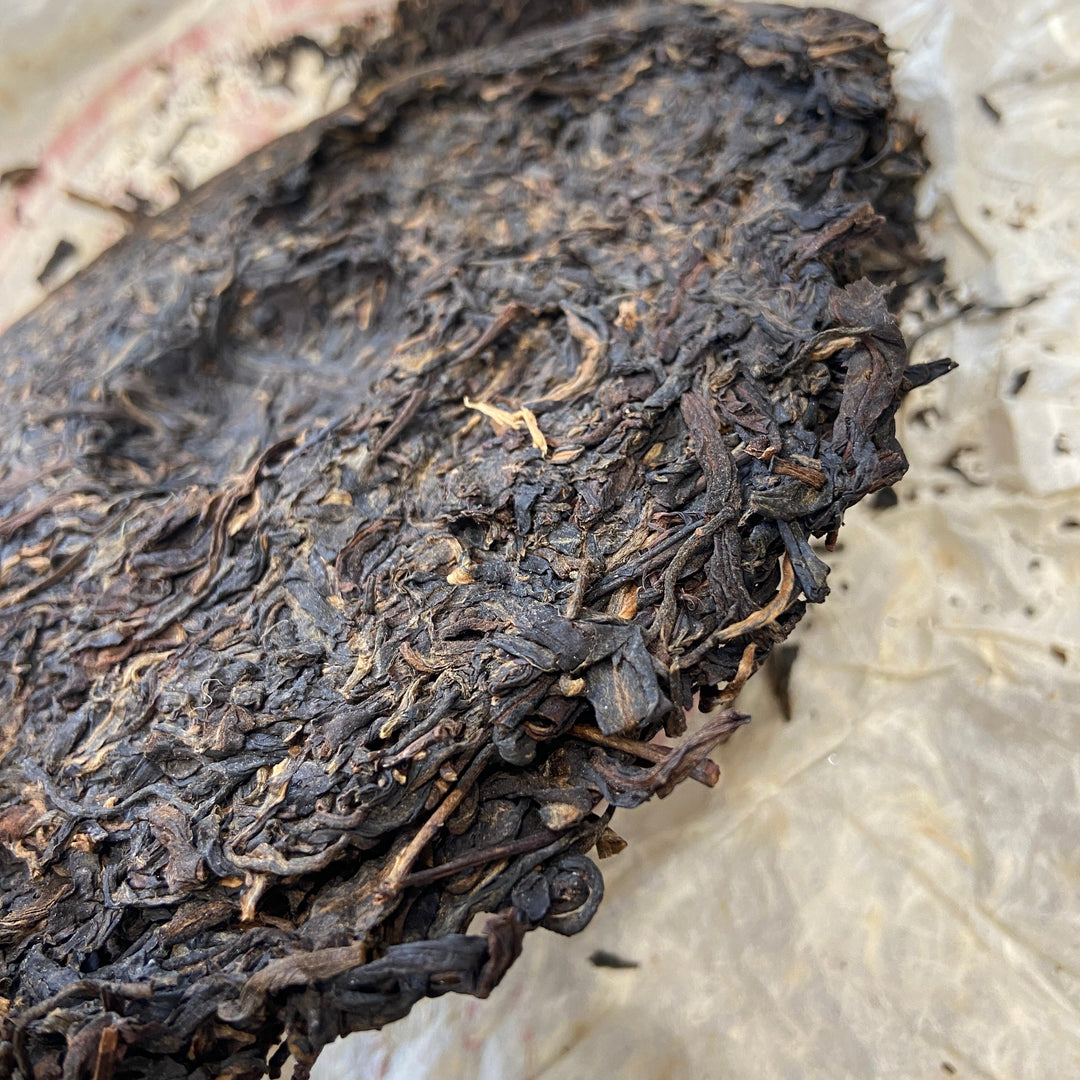 2004 LiMing "Cha Wang - Qiao Mu Ye Sheng - Ban Zhang & Bu Lang & Nan Nuo" (King Tea - Arbor Wild - Banzhang & Bulang & Nannuo) Cake 400g Puerh Sheng Cha Raw Tea