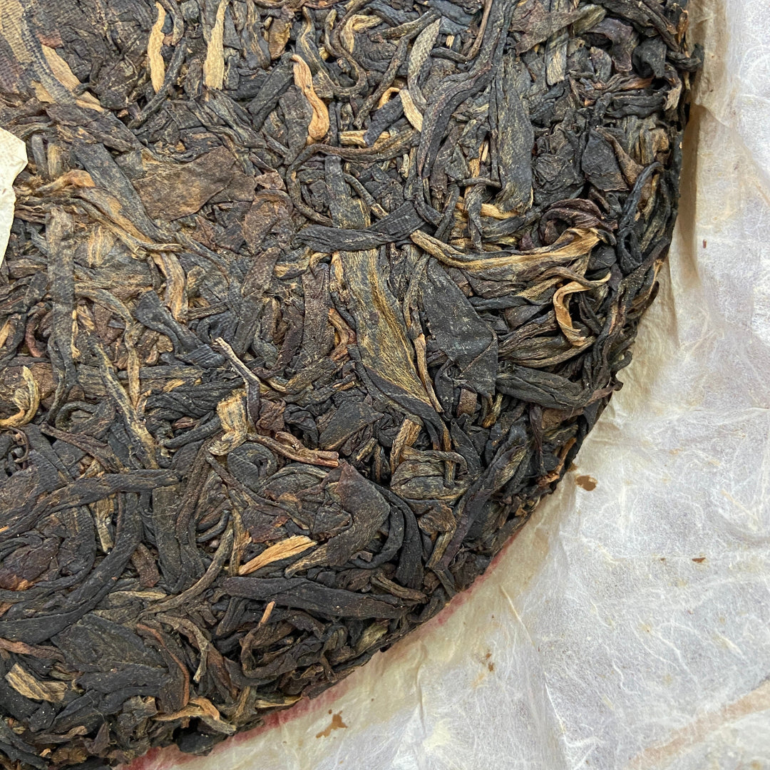 2004 LiMing "Cha Wang - Qiao Mu Ye Sheng - Ban Zhang & Bu Lang & Nan Nuo" (King Tea - Arbor Wild - Banzhang & Bulang & Nannuo) Cake 400g Puerh Sheng Cha Raw Tea