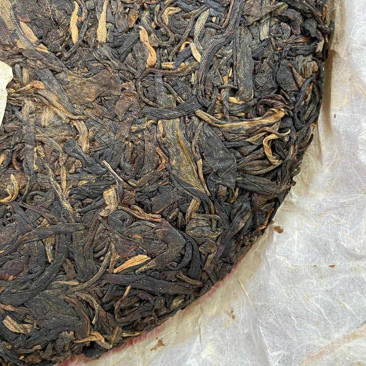 2004 LiMing "Cha Wang - Qiao Mu Ye Sheng - Ban Zhang & Bu Lang & Nan Nuo" (King Tea - Arbor Wild - Banzhang & Bulang & Nannuo) Cake 400g Puerh Sheng Cha Raw Tea
