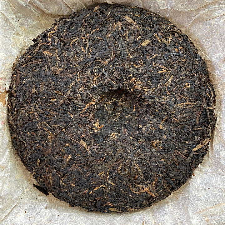 2004 LiMing "Cha Wang - Qiao Mu Ye Sheng - Ban Zhang & Bu Lang & Nan Nuo" (King Tea - Arbor Wild - Banzhang & Bulang & Nannuo) Cake 400g Puerh Sheng Cha Raw Tea
