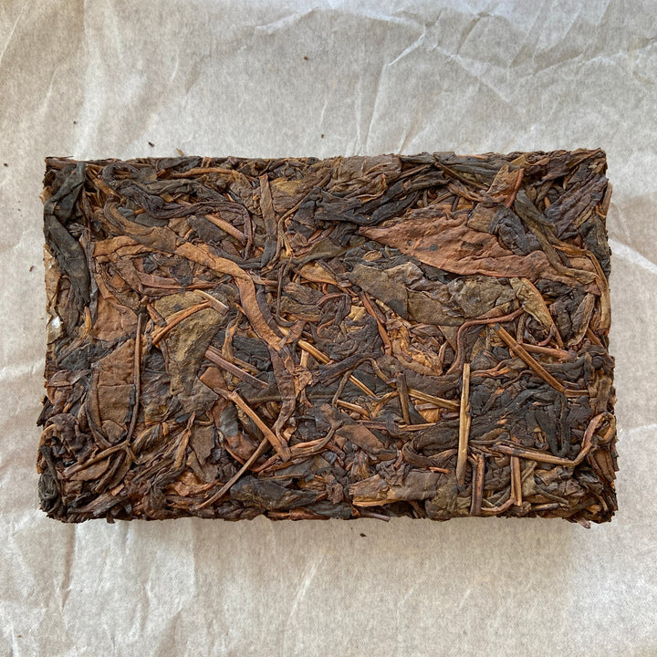 2014 TMK "Yi Wu - Gua Feng Zhai - Huang Pian" (Yiwu - GuaFengZhai - Huangpian / Yellow Leaf) Brick 250g Puerh Raw Tea Sheng Cha