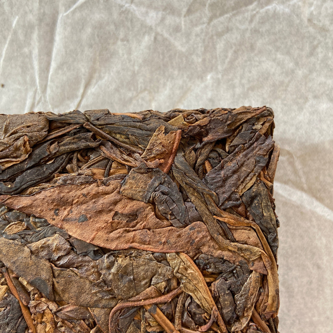 2014 TMK "Yi Wu - Gua Feng Zhai - Huang Pian" (Yiwu - GuaFengZhai - Huangpian / Yellow Leaf) Brick 250g Puerh Raw Tea Sheng Cha