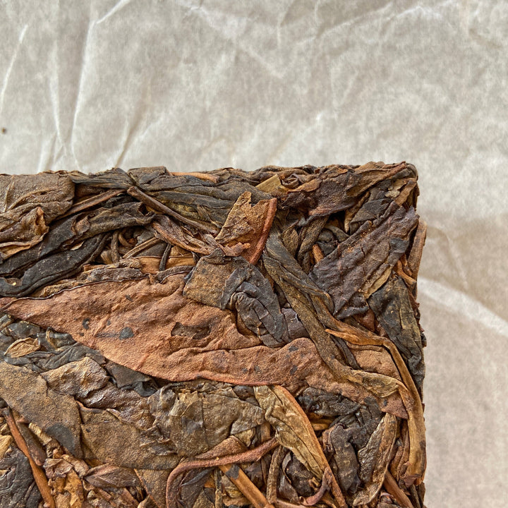 2014 TMK "Yi Wu - Gua Feng Zhai - Huang Pian" (Yiwu - GuaFengZhai - Huangpian / Yellow Leaf) Brick 250g Puerh Raw Tea Sheng Cha
