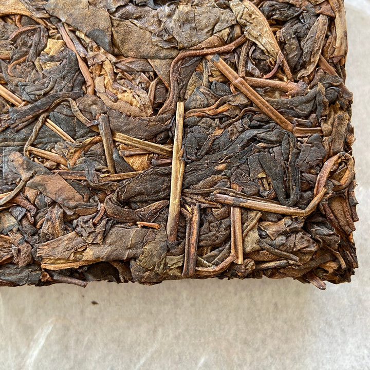 2014 TMK "Yi Wu - Gua Feng Zhai - Huang Pian" (Yiwu - GuaFengZhai - Huangpian / Yellow Leaf) Brick 250g Puerh Raw Tea Sheng Cha