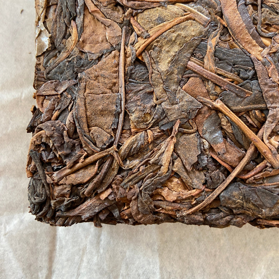 2014 TMK "Yi Wu - Gua Feng Zhai - Huang Pian" (Yiwu - GuaFengZhai - Huangpian / Yellow Leaf) Brick 250g Puerh Raw Tea Sheng Cha