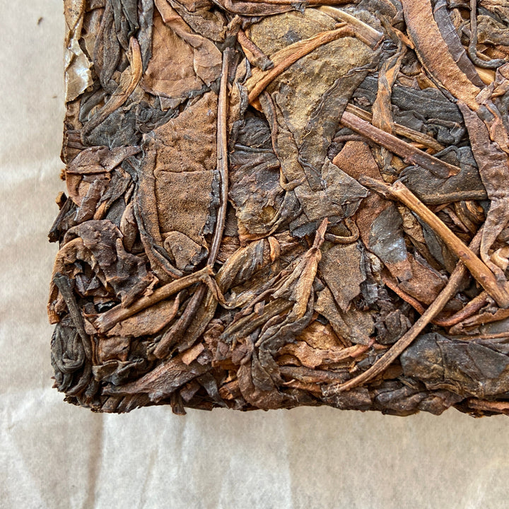 2014 TMK "Yi Wu - Gua Feng Zhai - Huang Pian" (Yiwu - GuaFengZhai - Huangpian / Yellow Leaf) Brick 250g Puerh Raw Tea Sheng Cha