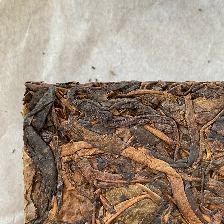 2014 TMK "Yi Wu - Gua Feng Zhai - Huang Pian" (Yiwu - GuaFengZhai - Huangpian / Yellow Leaf) Brick 250g Puerh Raw Tea Sheng Cha