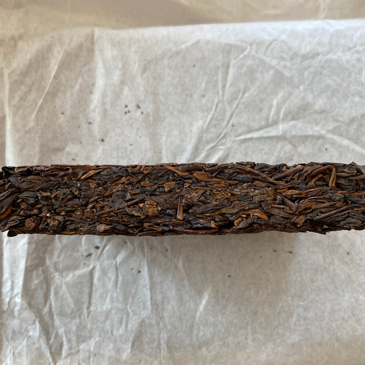 2014 TMK "Yi Wu - Gua Feng Zhai - Huang Pian" (Yiwu - GuaFengZhai - Huangpian / Yellow Leaf) Brick 250g Puerh Raw Tea Sheng Cha
