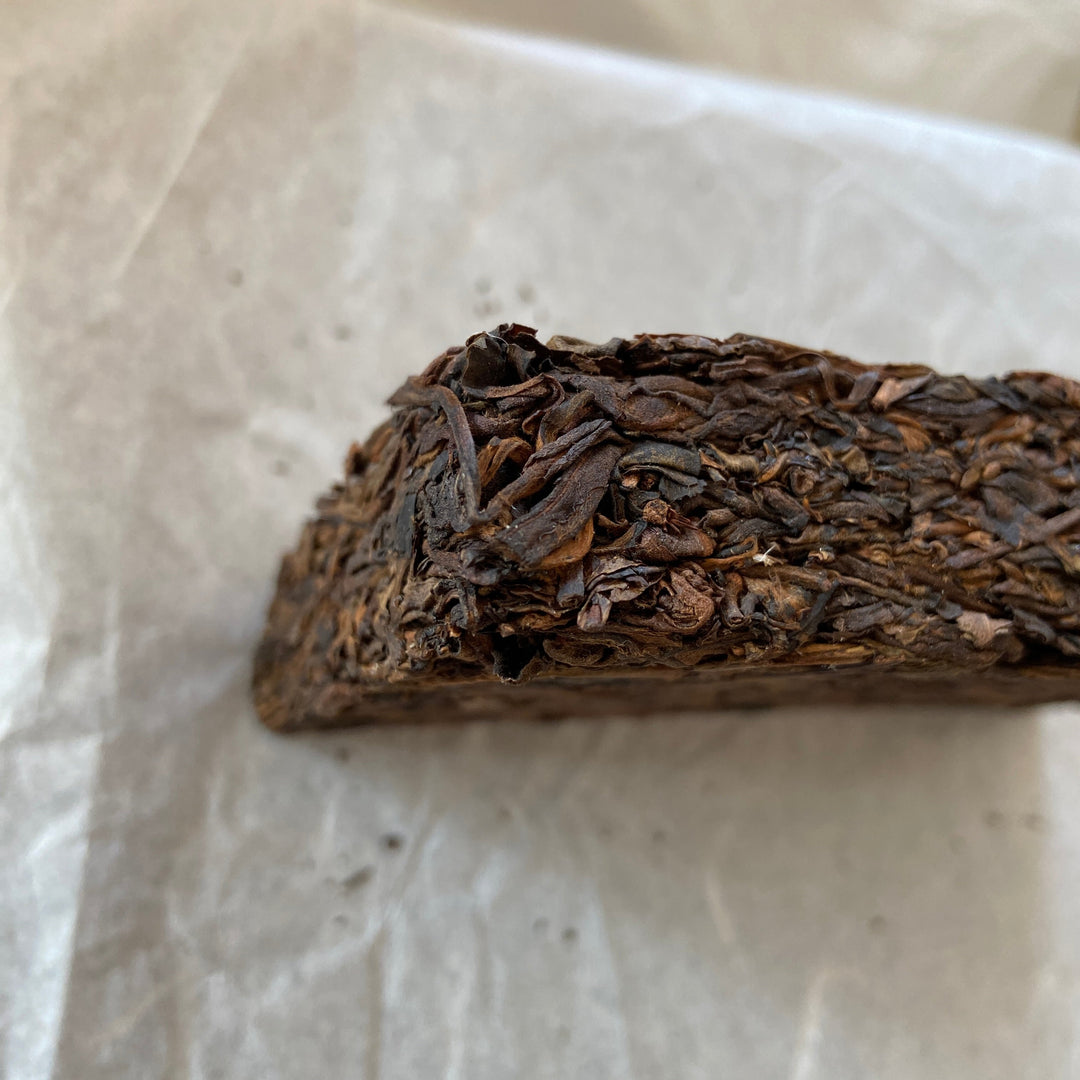 2014 TMK "Yi Wu - Gua Feng Zhai - Huang Pian" (Yiwu - GuaFengZhai - Huangpian / Yellow Leaf) Brick 250g Puerh Raw Tea Sheng Cha