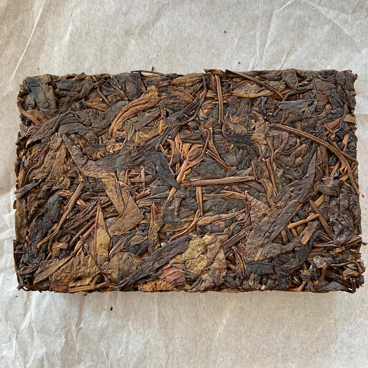 2014 TMK "Yi Wu - Gua Feng Zhai - Huang Pian" (Yiwu - GuaFengZhai - Huangpian / Yellow Leaf) Brick 250g Puerh Raw Tea Sheng Cha