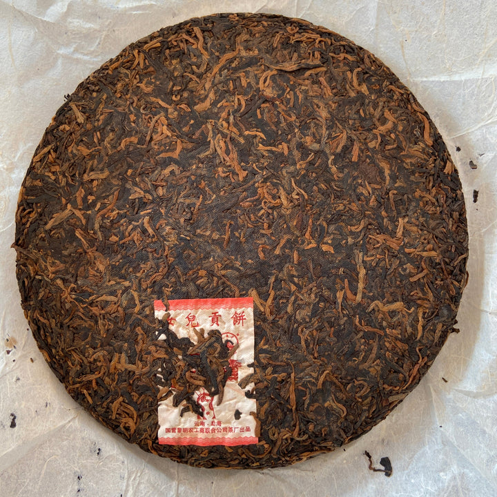 2006 LiMing "Nv Er Gong Bing - Bu Lang Shan - Qiao Mu Old Tree" (Girl's Tribute Cake - Bulang Mountain - Arbor Old Tree) 250g Puerh Ripe Tea Shou Cha