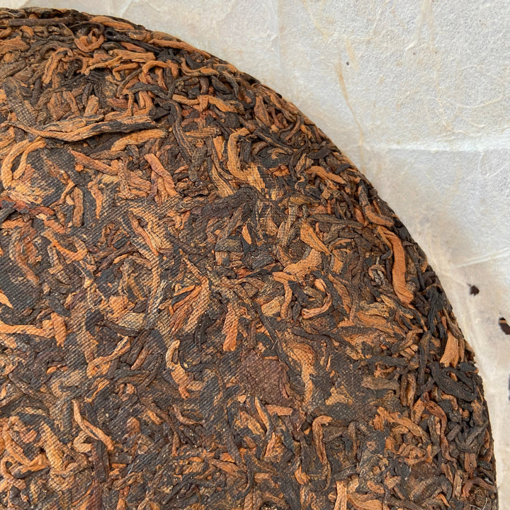 2006 LiMing "Nv Er Gong Bing - Bu Lang Shan - Qiao Mu Old Tree" (Girl's Tribute Cake - Bulang Mountain - Arbor Old Tree) 250g Puerh Ripe Tea Shou Cha