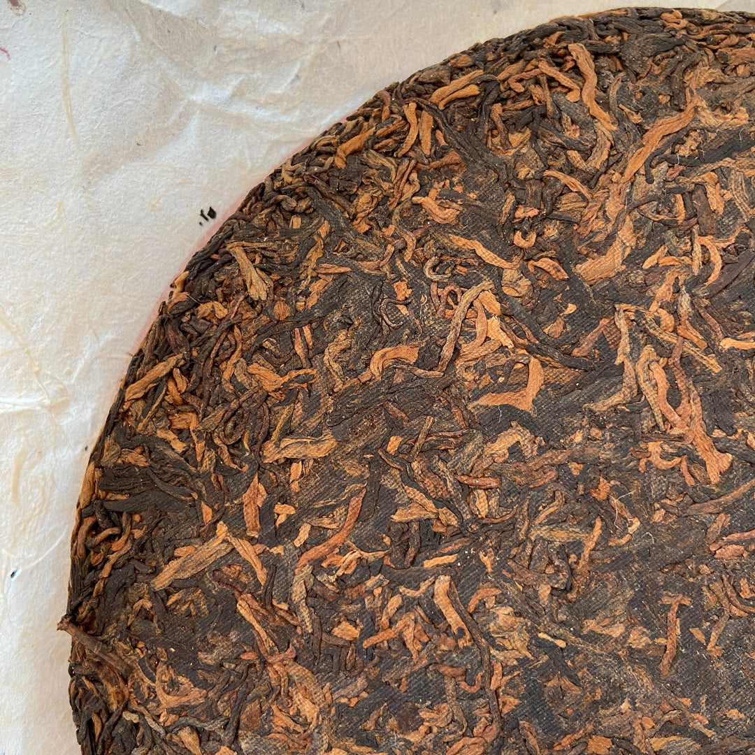 2006 LiMing "Nv Er Gong Bing - Bu Lang Shan - Qiao Mu Old Tree" (Girl's Tribute Cake - Bulang Mountain - Arbor Old Tree) 250g Puerh Ripe Tea Shou Cha
