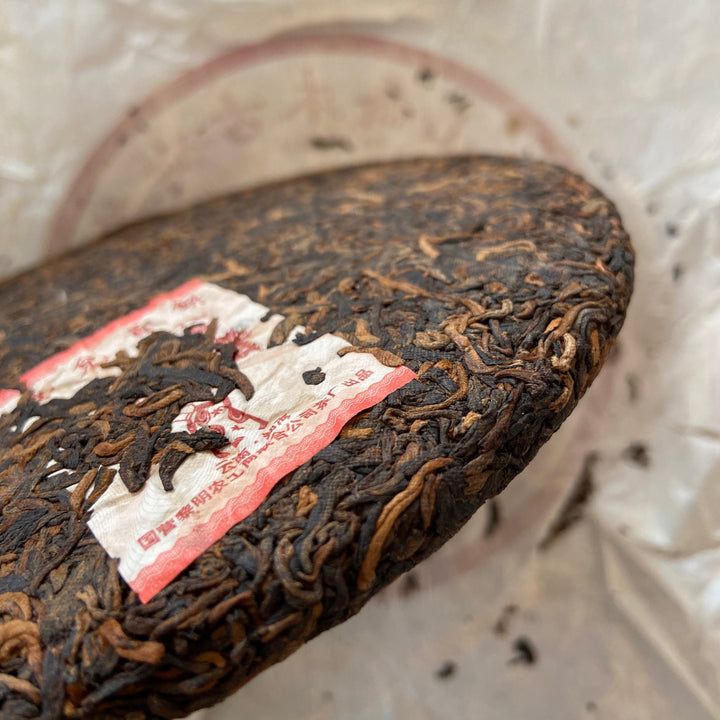 2006 LiMing "Nv Er Gong Bing - Bu Lang Shan - Qiao Mu Old Tree" (Girl's Tribute Cake - Bulang Mountain - Arbor Old Tree) 250g Puerh Ripe Tea Shou Cha