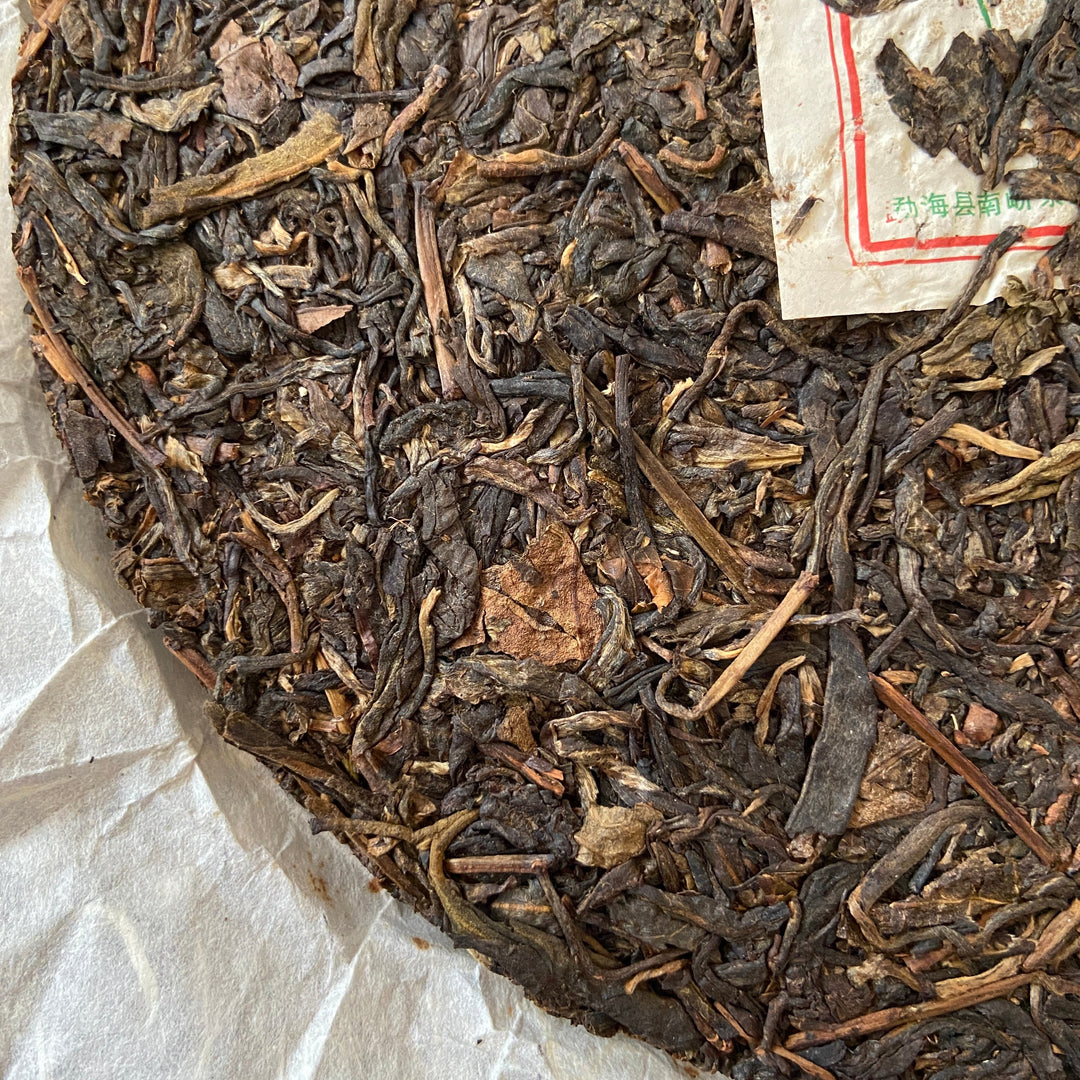 2007 NanQiao "Che Fo Nan-Tie Bing" (Iron Cake) Cake 357g Puerh Raw Tea Sheng Cha, Meng Hai