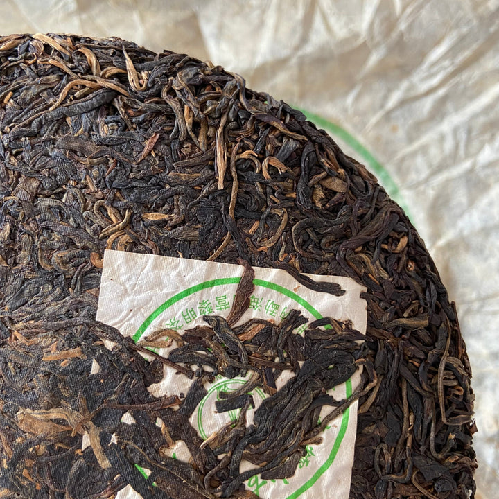 2004 LiMing "Nan Nuo Shan - Gu Qiao Mu" (Nannuo Mountain - Ancient Arbor Tree) Cake 357g Puerh Raw Tea Sheng Cha