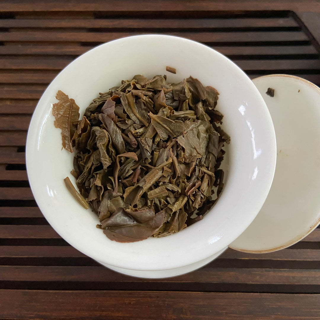 2007 LiMing "Bu Lang Shan - Qiao Mu Gu Shu - Nv Er Gong Bing" (Bulang Mountain - Ancient Arbor Tree) Cake 357g Puerh Raw Tea Sheng Cha