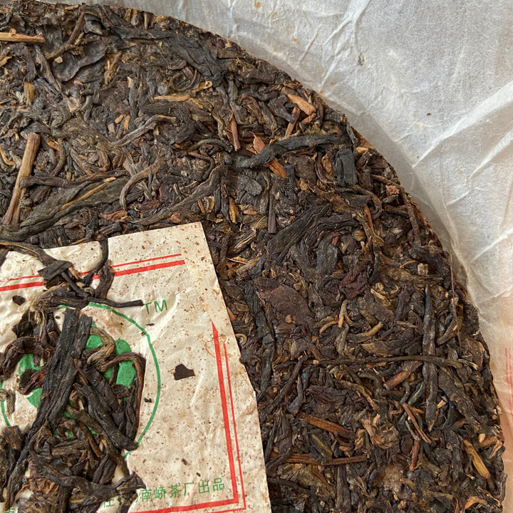2007 NanQiao "Che Fo Nan-Tie Bing" (Iron Cake) Cake 357g Puerh Raw Tea Sheng Cha, Meng Hai
