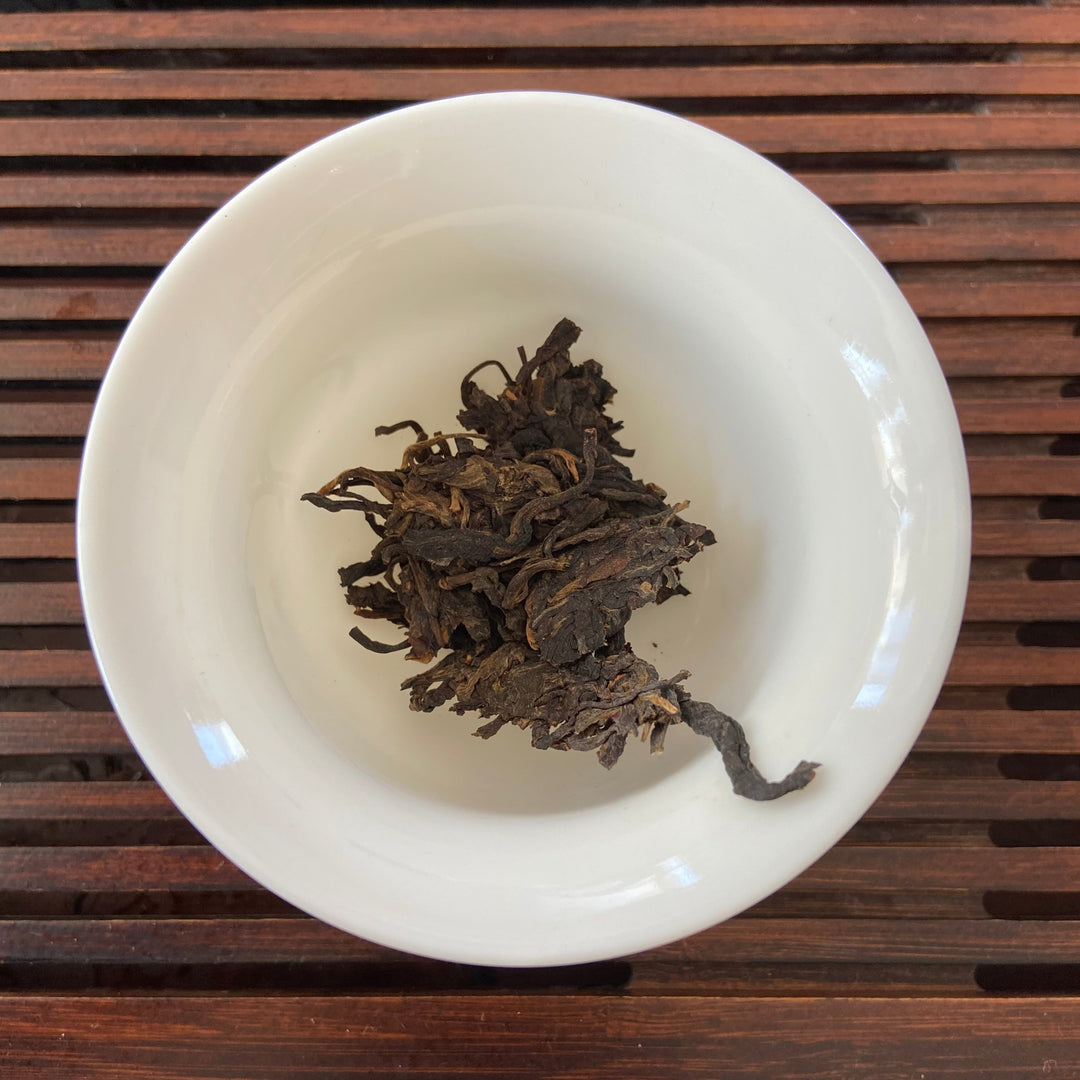 2006 LiMing "Bu Lang Shan - Qiao Mu Gu Shu - Nv Er Gong Bing" (Bulang Mountain - Ancient Arbor Tree - Tribute Tea) Cake 250g Puerh Raw Tea Sheng Cha