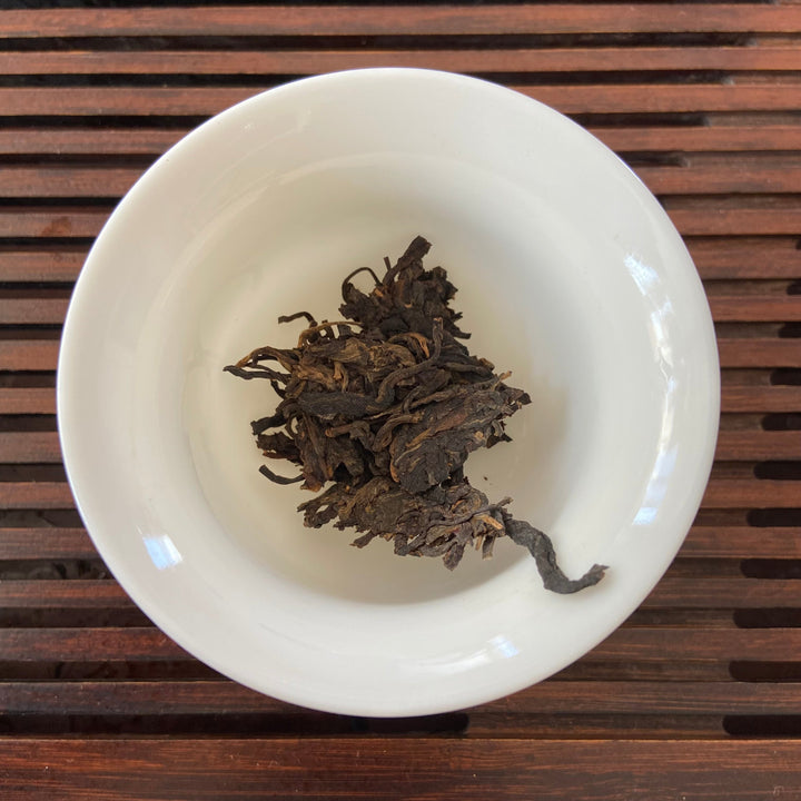 2006 LiMing "Bu Lang Shan - Qiao Mu Gu Shu - Nv Er Gong Bing" (Bulang Mountain - Ancient Arbor Tree - Tribute Tea) Cake 250g Puerh Raw Tea Sheng Cha