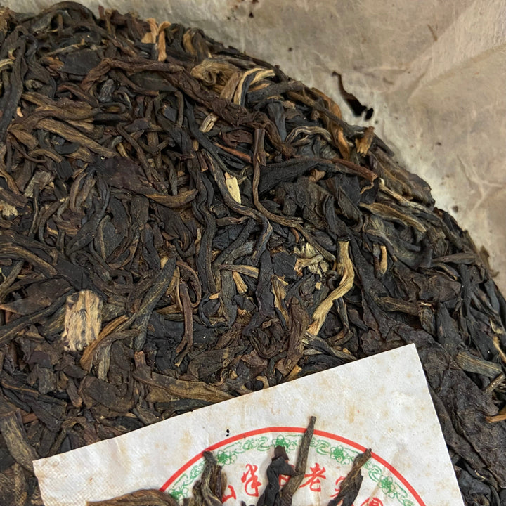 2006 NanQiao ShuangShiHao "Nan Nuo Shan - Ban Po Lao Zhai " (Nannuo Mountain - Banpo Old Village) Cake 357g Puerh Raw Tea Sheng Cha