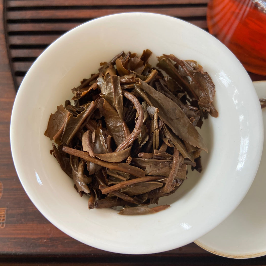 2006 LiMing "Bu Lang Shan - Qiao Mu Gu Shu - Nv Er Gong Bing" (Bulang Mountain - Ancient Arbor Tree - Tribute Tea) Cake 250g Puerh Raw Tea Sheng Cha