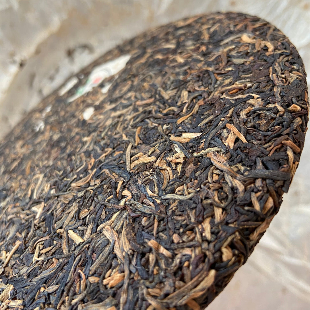 2006 NanQiao "Nan Nuo Yin Hao" (Nannuo mountain - Silver Buds) Cake 250g Puerh Raw Tea Sheng Cha, Meng Hai