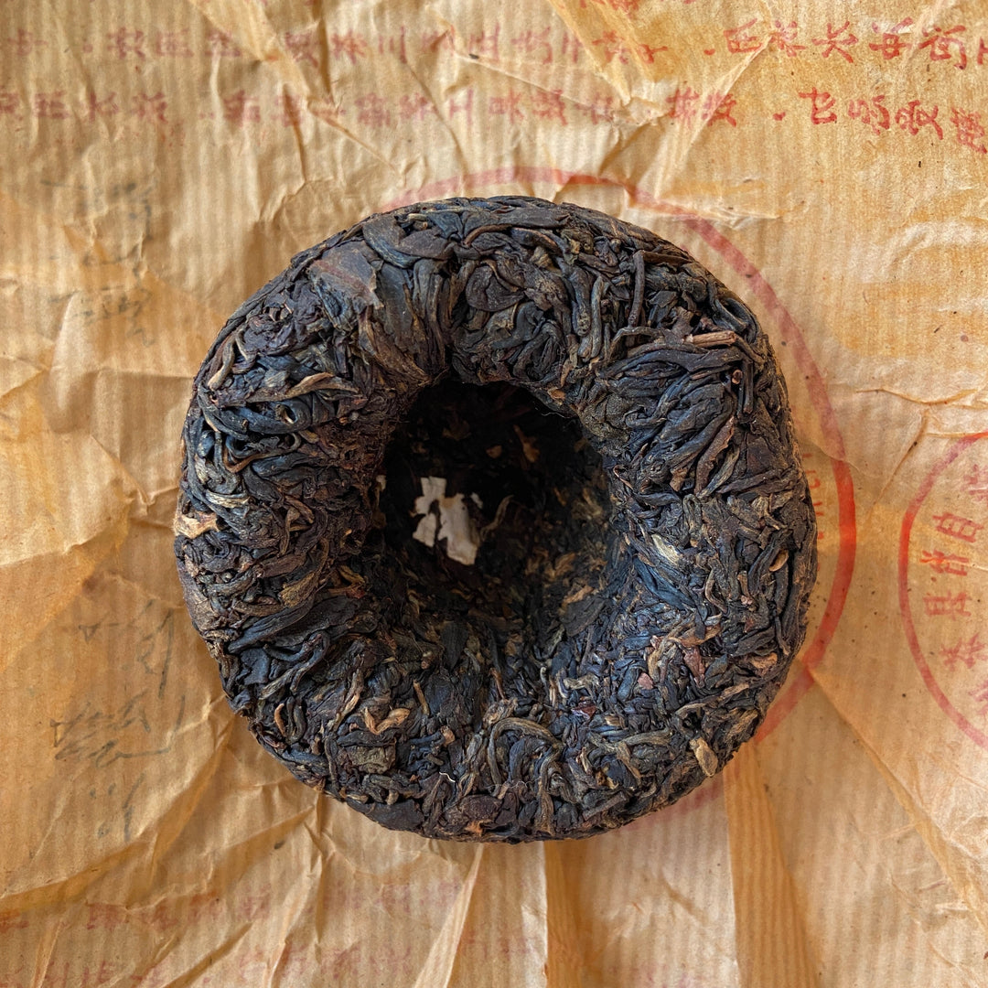 2003 TuLinFengHuang "10 Zhou Nian - Qian Ming " (10th Year’s Commemoration of Recovery- Signed) Tuo 100g Puerh Sheng Cha Raw Tea
