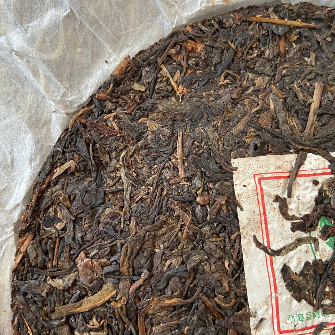 2007 NanQiao "Che Fo Nan-Tie Bing" (Iron Cake) Cake 357g Puerh Raw Tea Sheng Cha, Meng Hai