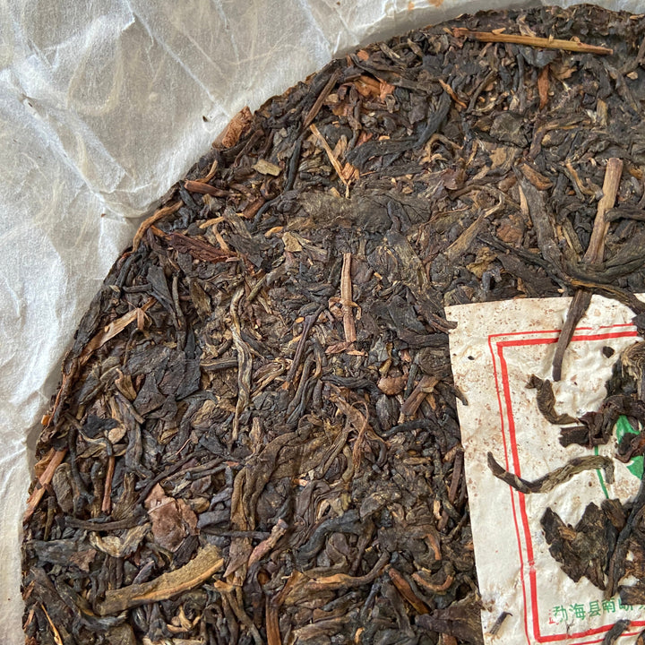 2007 NanQiao "Che Fo Nan-Tie Bing" (Iron Cake) Cake 357g Puerh Raw Tea Sheng Cha, Meng Hai
